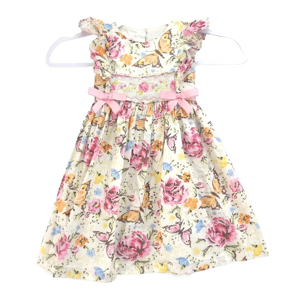 Bonnie Jean smocked rose and butterfly print dress in a cream color